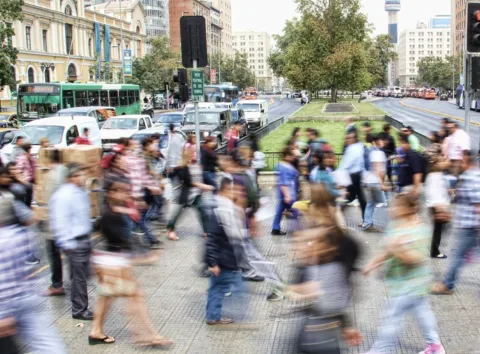 People walking briskly through the streets; Photo by mauro mora